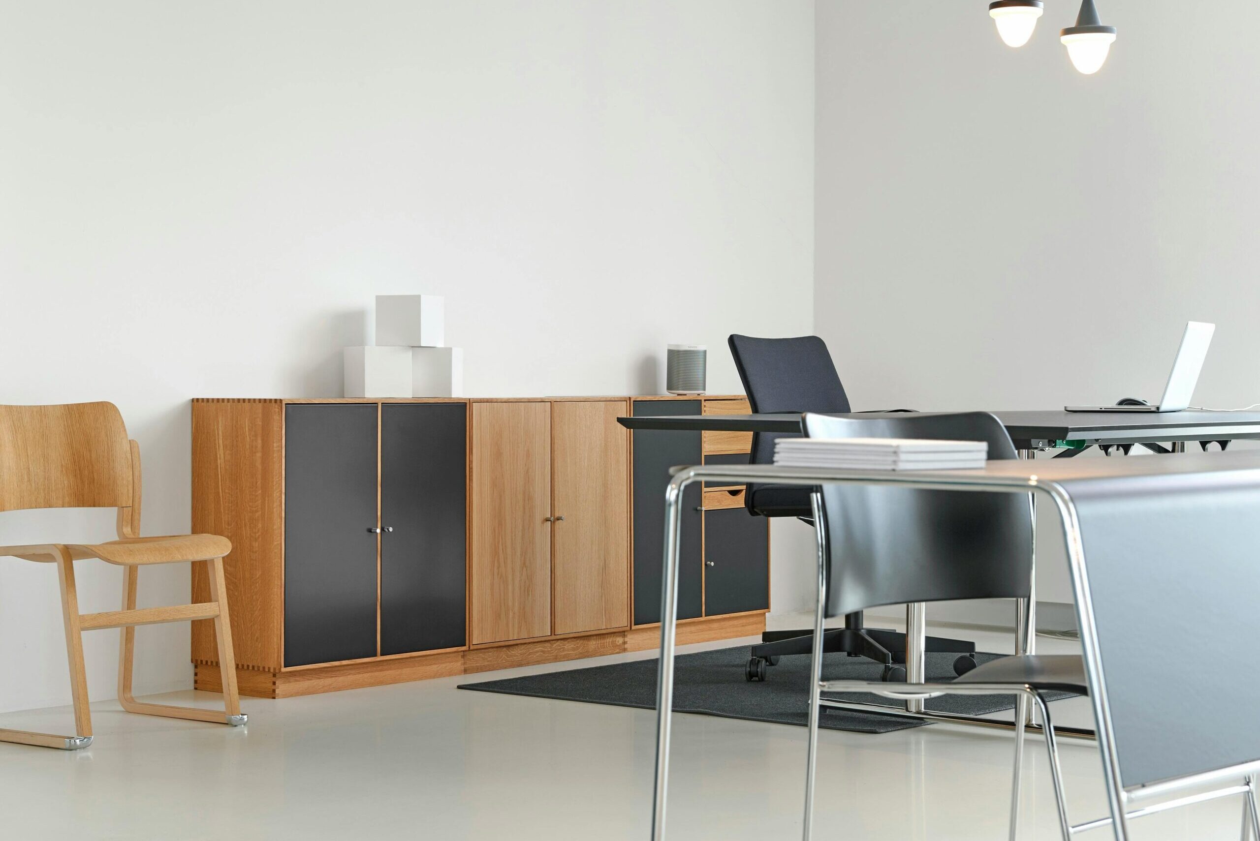 A clean and organized modern office space with stylish furniture and decor.